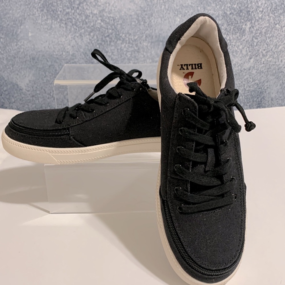 Black and White Low-Top Sneakers with Zip around for easy on & off.